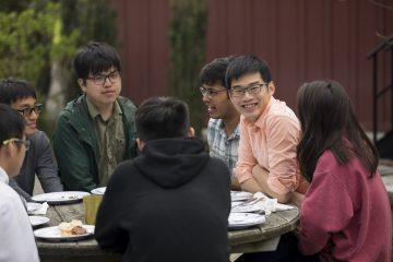 Students at the annual year-end barbecue at the Big Red Barn