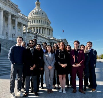 Cornell doctoral students with Representative Melanie Stansbury outside the Capitol